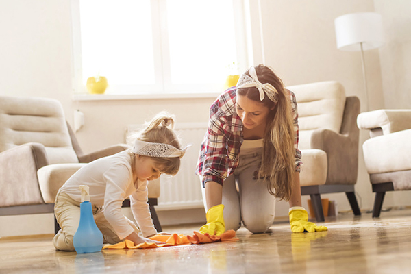 a other and daughter cleaning the floor together
